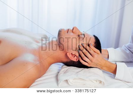 Male Masseur Doing Massage Health Spa Procedure
