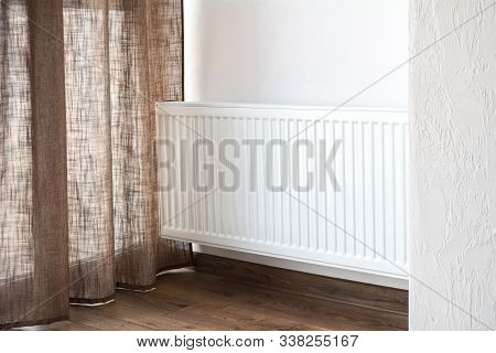 White Adiator In The Room. Autonomous Heating
