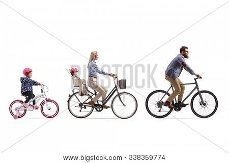 Father, mother and two girls riding a bicycle with a child seat isolated on white background