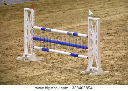 Image Of Show Jumping Poles On Empty Training Field. Wooden Barriers For Jumping Horses As A Backgro
