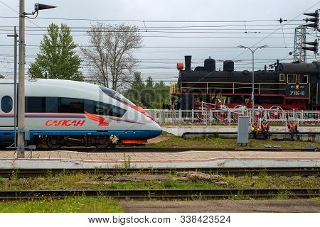 Bologoye, Russia - August 8, 2019: Sapsan High-speed Train At Bologoe Station Opposite The Old Steam