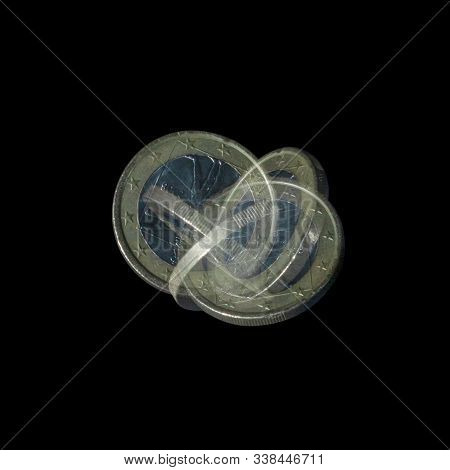 Spinning Coin In Stroboscopic Light On Black Background. Italian One Euro, Close Up