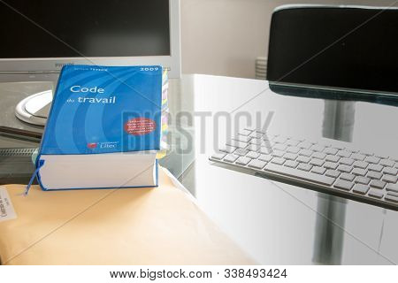 French Labor Code Book Pictured With Computer In Studio