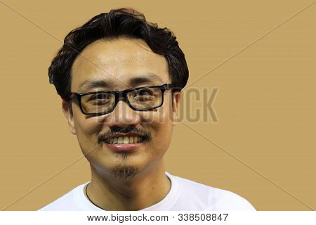 A Smiling And Confident Manipuri North East Indian Man With Spectacles
