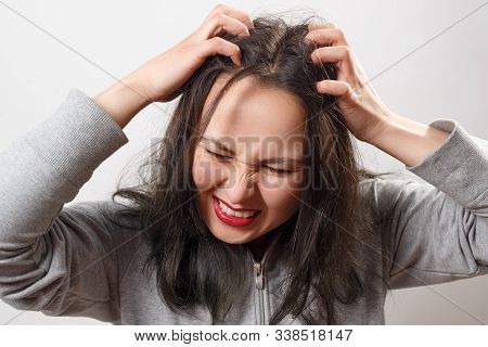 A Young Woman Scratches Her Scalp And Hair With Her Fingers. Hair Health Concept, Scalp And Hair Car