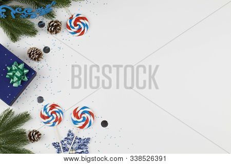 Christmas Background. Christmas Boxe With Lollipops, Cone , Snowflakes And Christmas Tree Branches O