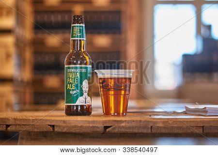 COPENHAGEN, DENMARK - MAY 9, 2018: Brewmasters India Pale Ale on a bar table poured in a cup