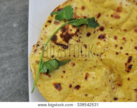 Home Made Gluten Free Chickpea Flour Roti Or Besan Roti Or Chapati Or Bread On A Plate .