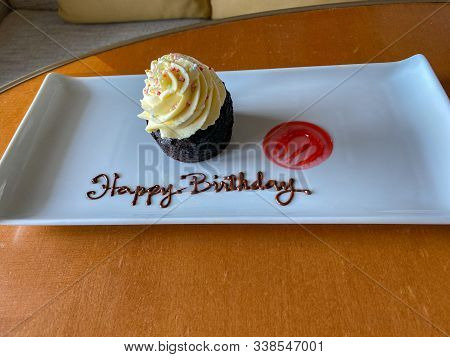 A Birthday Cupcake Delivered To A Cruise Ship Passenger Wishing Them A Happy Birthday.