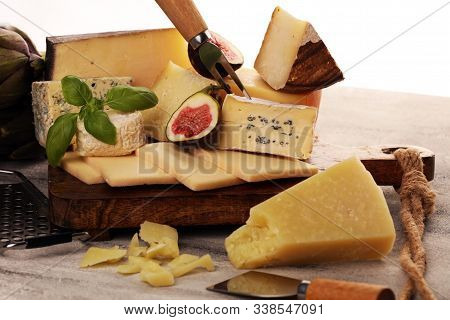 Different Sorts Of Cheese. Cheese Platter With Different Cheese And Spice