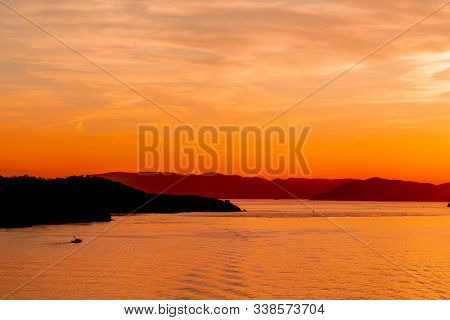 Silhouette Island With Sunset In Colorful Light Background Fot Paradise Exotic Color For Vacation An