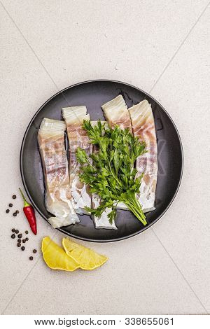 Raw Pollock (pollachius Virens) Pieces. Fresh Fish For Healthy Food Lifestyle. Lemon, Parsley, Sea S