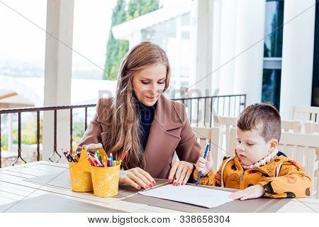 Mother And Son In The Restaurant Painted Before Eating