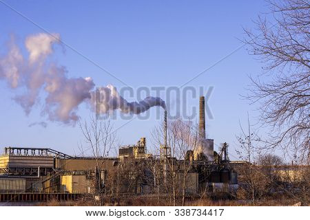 Manitowoc,wi Usa, December 10 2019
Hot Steam On A Frosty Day
Rises From The Chimney Of The Manufactu