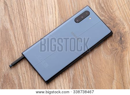 Rostov-on-don, Russia - December 2019. Samsung Galaxy Note 10 On A Wooden Table. Smartphone And Styl