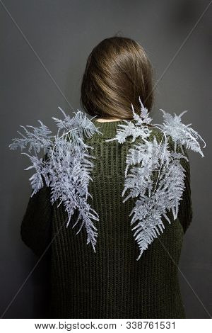 Rear View Of A Girl With Dark Hair And Wings From An Asparagus Setaceus Plant, Dryad Or Nymph Backgr