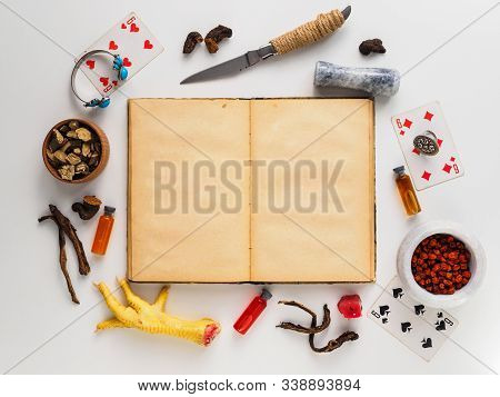 A Book And A Set Of Attributes For Magic, Divination, And Other Occult.