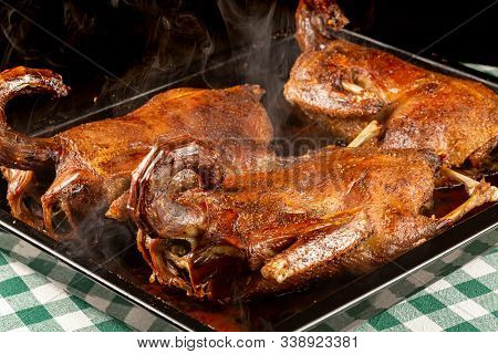 Roasted Smoky Ducks In A Cooking Tray On A Green Napkin