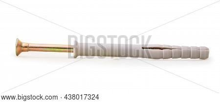 One Countersunk Self-tapping Screw In A Plastic Dowel Isolated On A White Background, Close-up