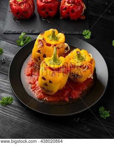 Jack O Lanterns Stuffed Yellow Pepper For Halloween.