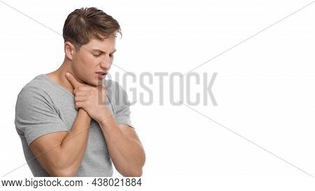 Despaired Sad Millennial Caucasian Male Suffering From Throat Pain Presses His Hand To Throat