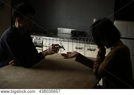 A Man Giving A Key To A Woman