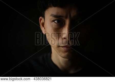 Image Of A Man Who Sheds Tears
