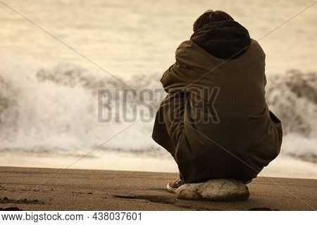 Image Of A Man Depressed In The Sea