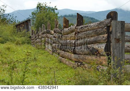 Russia. Transbaikalia, Chita Region. A Wooden Fence Made Of Boards And Poles, Which Enclose Pastures