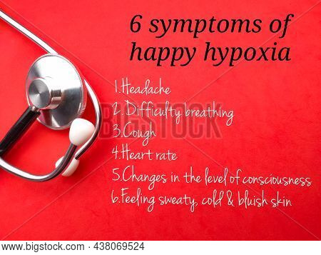 Stethoscope With Text 6 Symptoms Of Happy Hypoxia  On A Red Background. Healthcare Concept.