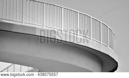 Bicycle Path And Sidewalk Through The Highway Bridge. Black And White.