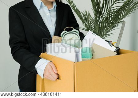 A Woman Office Worker Is Unhappy With Being Fired From A Company Packing Things Into Cardboard Boxes
