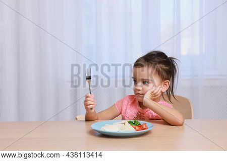 Cute Little Girl Refusing To Eat Her Breakfast At Home, Space For Text