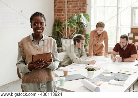 Portrait Pof Young Black Woman Smiling At Camera While Working In Creative Design Studio, Copy Space
