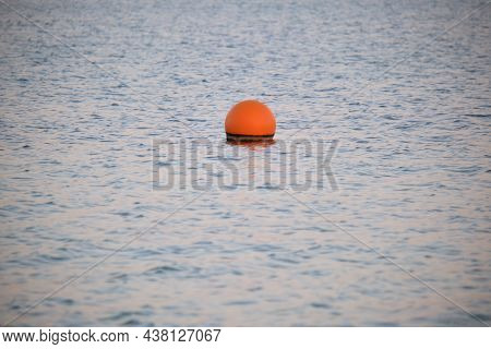Yellow Buoy Floating On Sea Surface As Marker For Swimming Restriction In Deep Water At Tropical Res