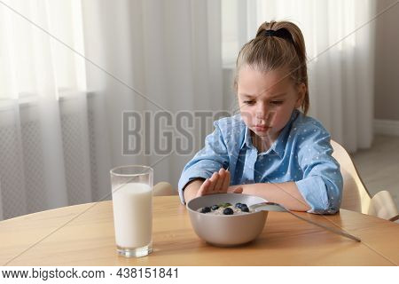 Cute Little Girl Refusing To Eat Her Breakfast At Home, Space For Text