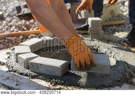 Sewerage Construction With Utility Worker Installing Manhole Sewage Reconstruction A Pit For A Septi