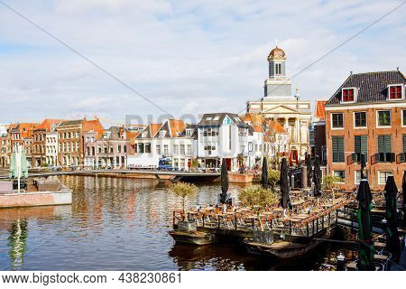 Cityscape Of Leiden, The Netherlands. View Of New Rhine River And Dutch Houses.