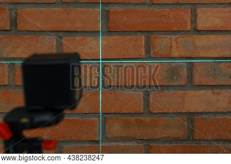 Cross Lines Of Laser Level On Brick Wall