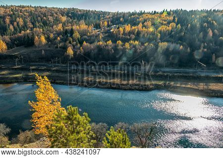 A Picturesque Top View Of The Sylva River And The Autumn Trees Growing Nearby. Photo Taken In Kurgur