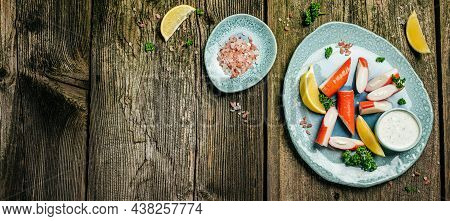 Crab Stick Surimi On Ceramic Plate Rustic Wooden Table. Long Banner Format. Top View.