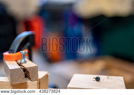 Selective Focus On Cracked And Split Wood From Not Drilling A Pilot Hole Before Driving A Screw
