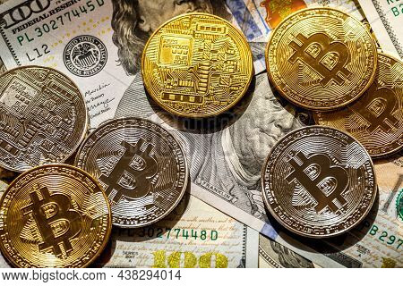 Golden Bitcoin Lies On The Banknotes.new Virtual Money. Crypto Currency Top View. Real Coins Of Bitc