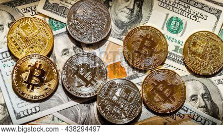 Golden Bitcoin Lies On The Banknotes.new Virtual Money. Crypto Currency Top View. Real Coins Of Bitc