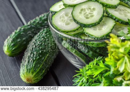 Cucumber On  Dark Wood Texture Background.cucumbers Harvest In Summer. Cucumbers For Salads Or Canni