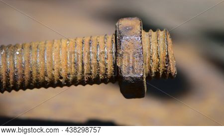 Old Rusty Bolt, Iron Rod With Screw Threads. Rusted Mechanical Components. Threaded Bolt And Nut Iso