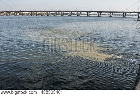 Dirty Orange Water From Sewage Pipeline Mixes With River Water.