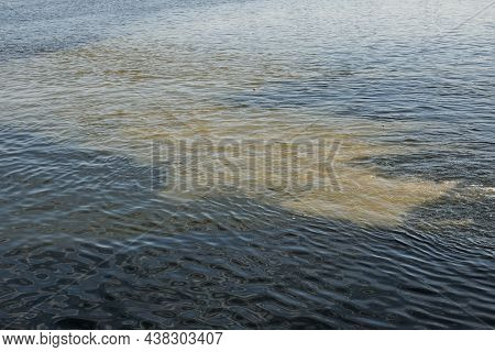Dirty Orange Water From Sewage Pipeline Mixes With River Water.