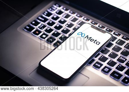 Malaga, Spain - 30 October 2021: Meta Logo In Mobile Phone That Is Placed On Laptop Keyboard. Meta I