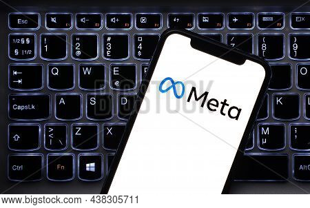 Malaga, Spain - 30 October 2021: Meta Logo In Mobile Phone That Is Placed On Laptop Keyboard. Meta I